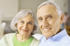 smiling elderly couple