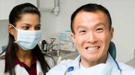 Man smiling at the dentist.